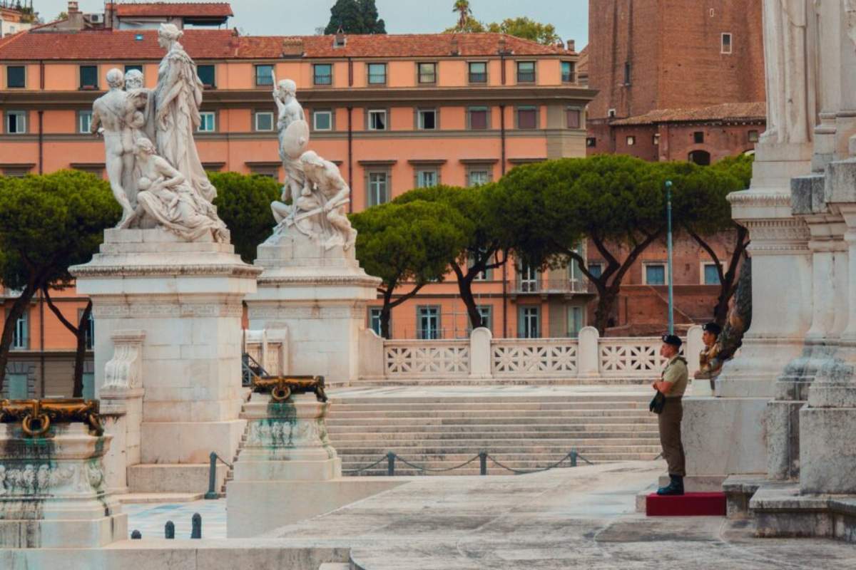 Sunny Roman piazza with statues and historic architecture