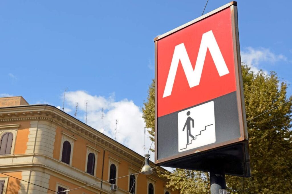 Red "M" sign indicating Rome Metro public transport entrance