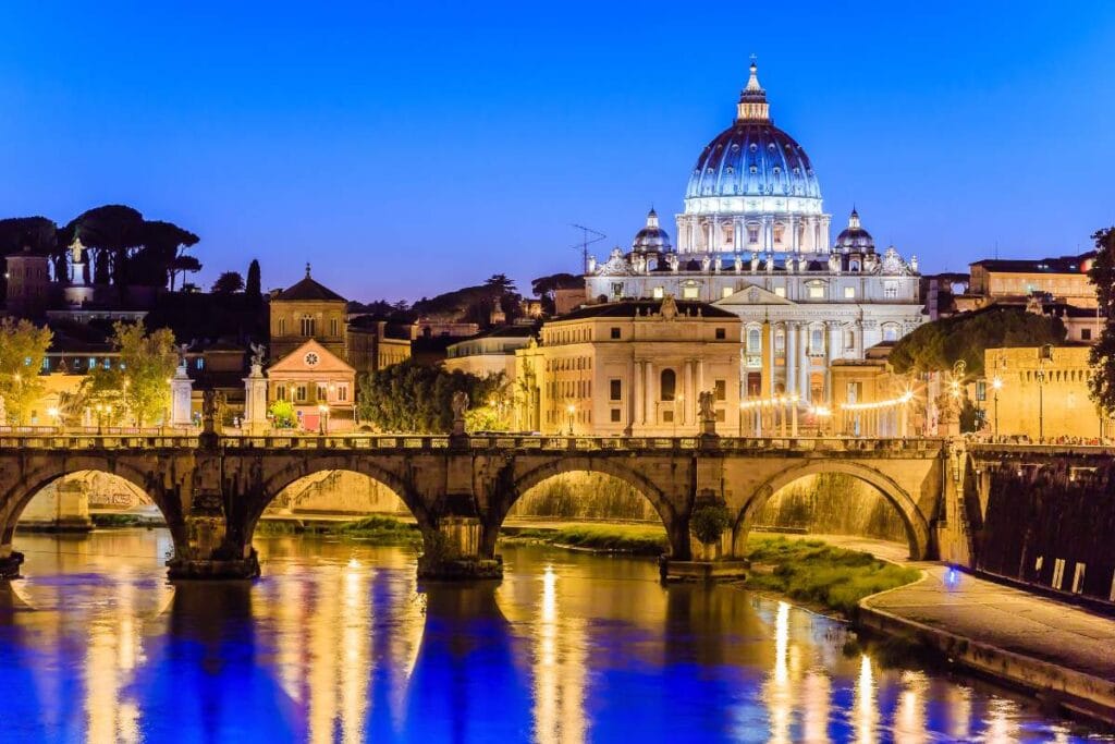 Illuminated St. Peter's Basilica view at night, perfect ending to a Rome family trip