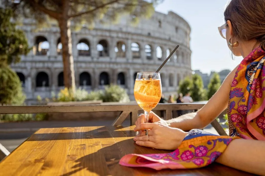 Relaxing with a drink overlooking the Colosseum during a stress-free Rome family vacation